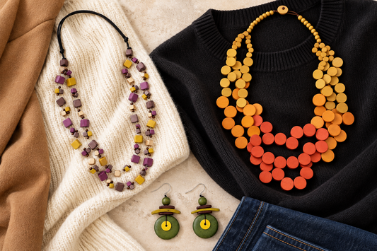 Colorful jewelry styled with fall knits and denim