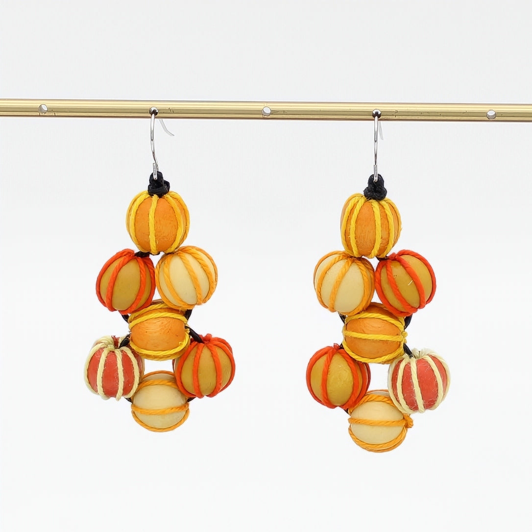 Pair of colorful stacked sphere earrings on a white background