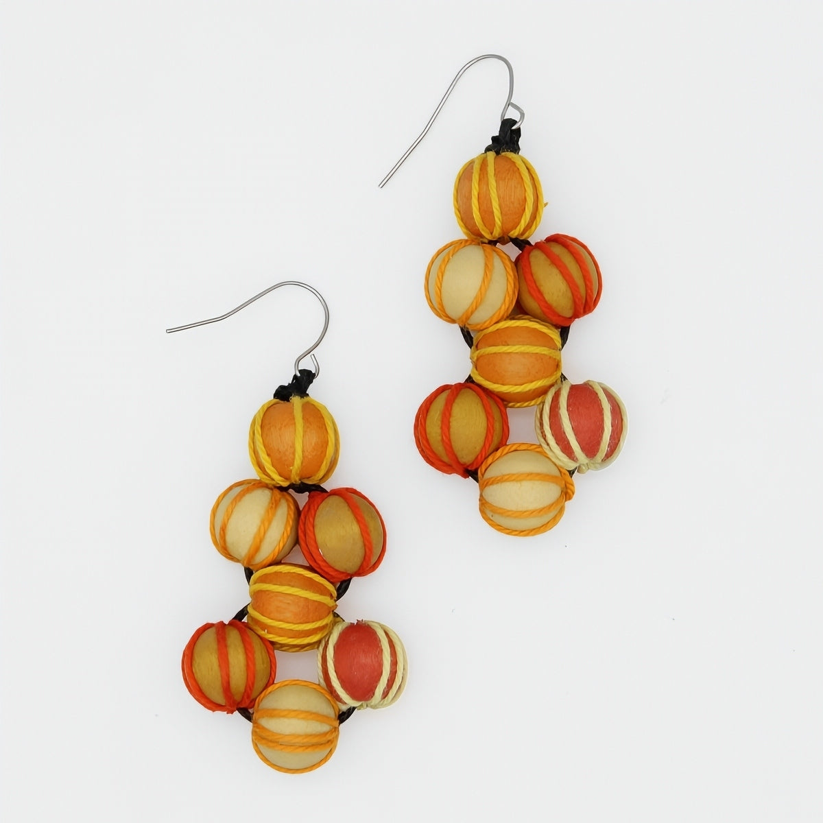 Pair of colorful beaded earrings on a white background