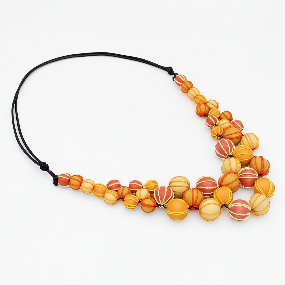 Necklace with orange and yellow beaded design on a white background