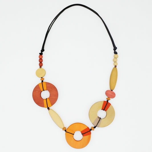 Necklace with colorful circular beads on a white background