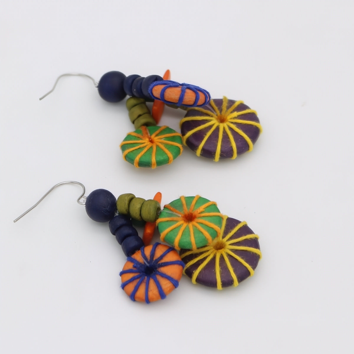 Colorful beaded earrings on a white background