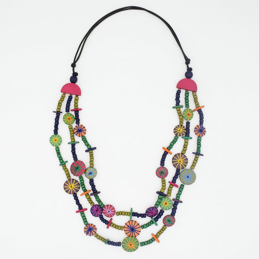 Colorful beaded necklace with a pink pendant on a white background