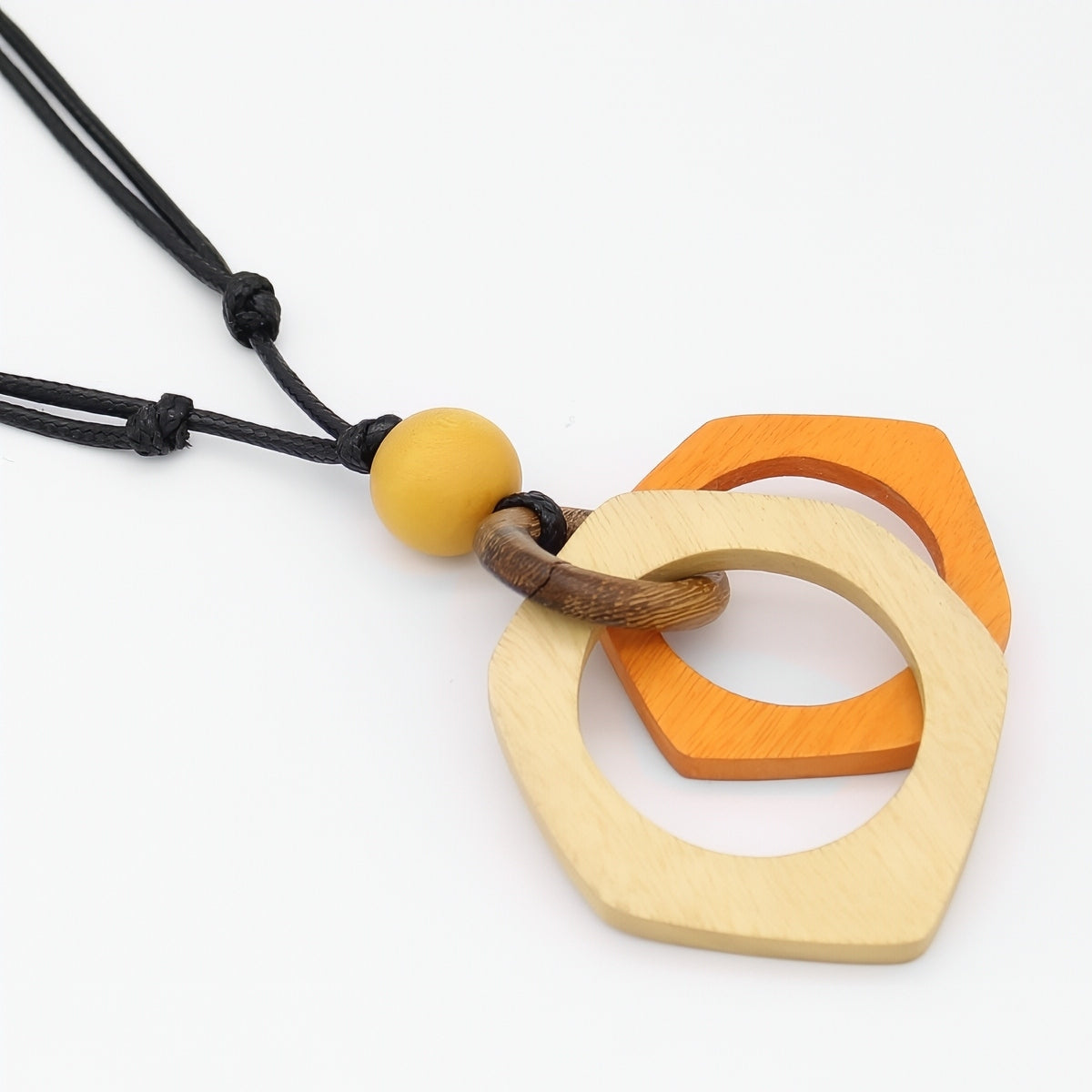 Necklace with geometric wooden pendants on a white background