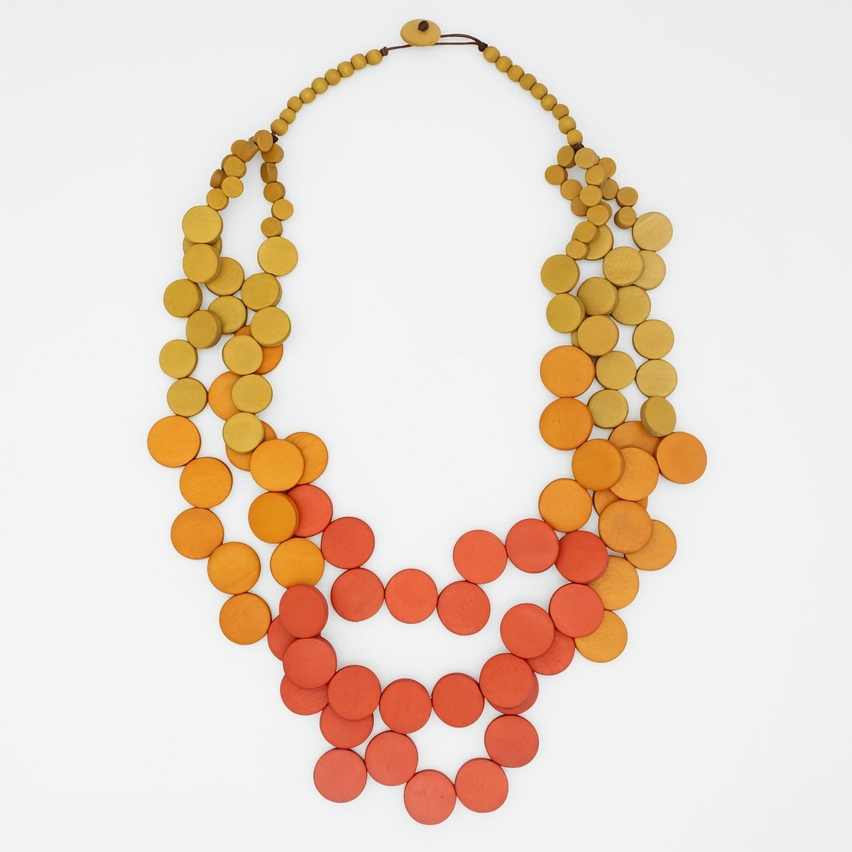 Necklace with orange and yellow colorful circular beads on a white background