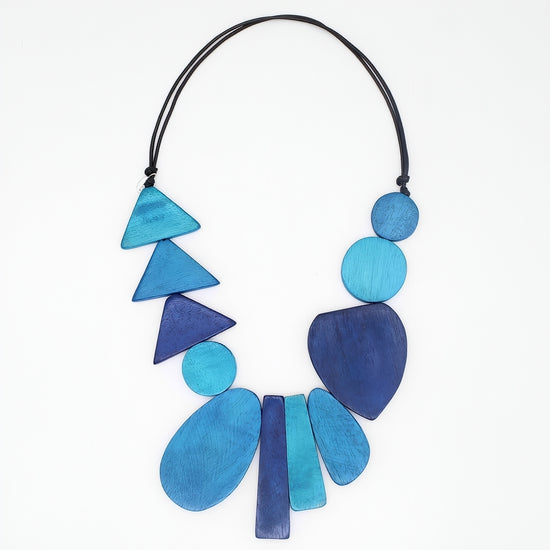 Necklace with blue geometric beads on a white background