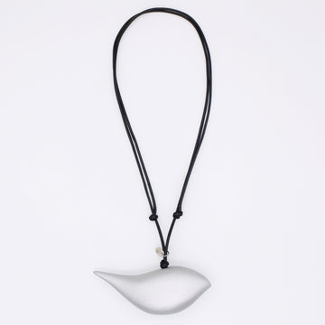 silver bird pendant on a black cord against a white background