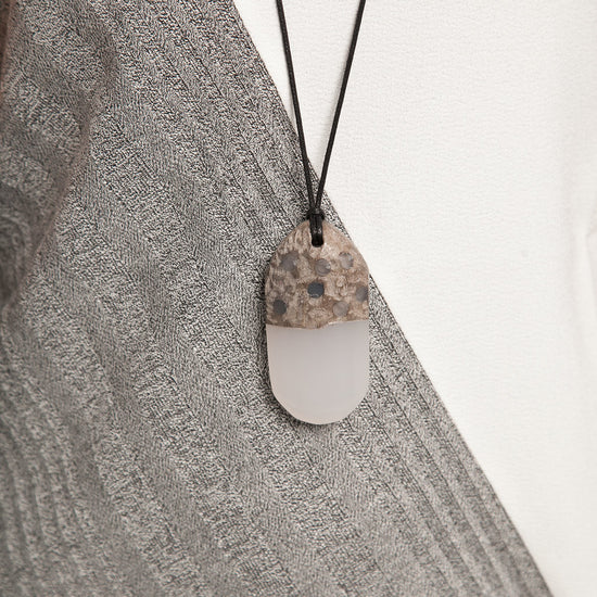 Geode inspired pendant necklace worn close up
