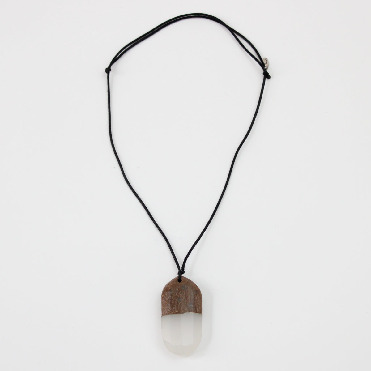 Adjustable geode inspired pendant necklace flat lay