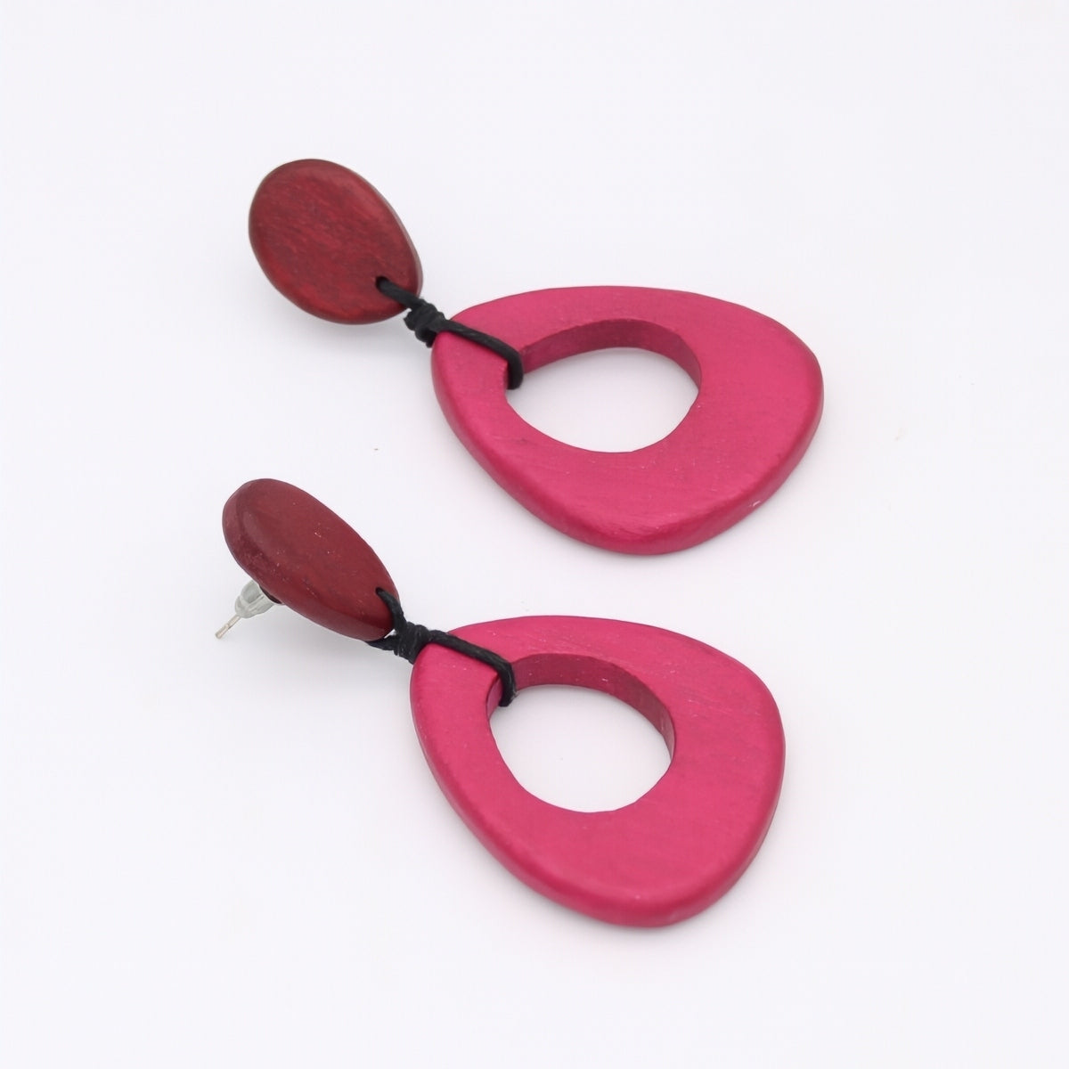 Pair of pink and red earrings on a white background