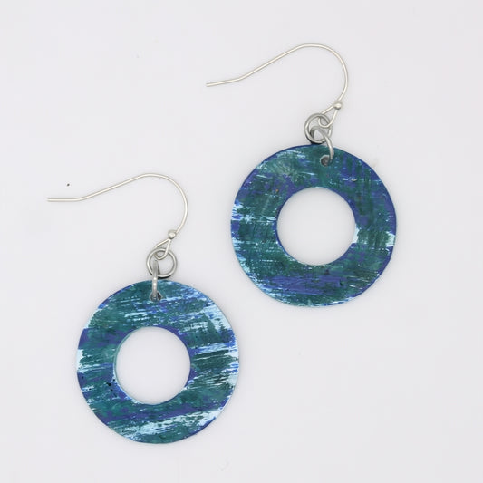 Pair of blue and green circular earrings on a white background