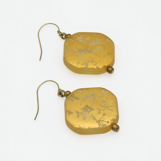 Gold resin drop earrings showing translucent resin and metallic foil, angled view