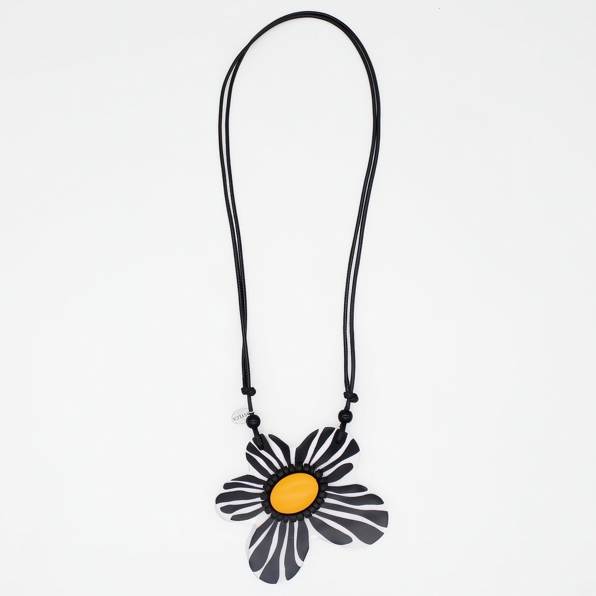 Necklace with a black and yellow flower pendant on a white background