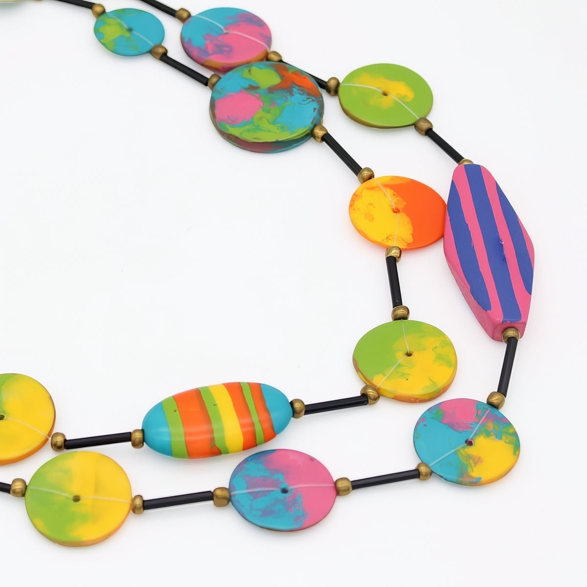 Colorful necklace with multicolored beads on a white background