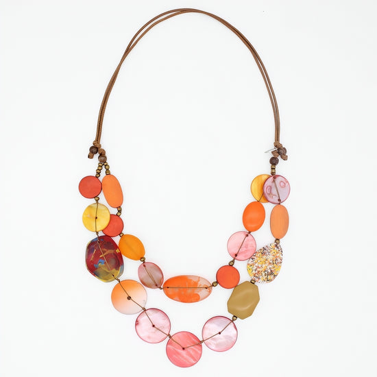 Colorful necklace with multicolored beads on a white background