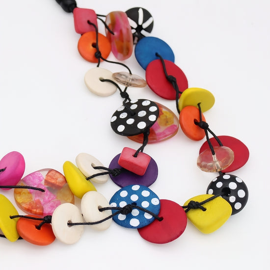 Colorful necklace with various shaped beads on a white background
