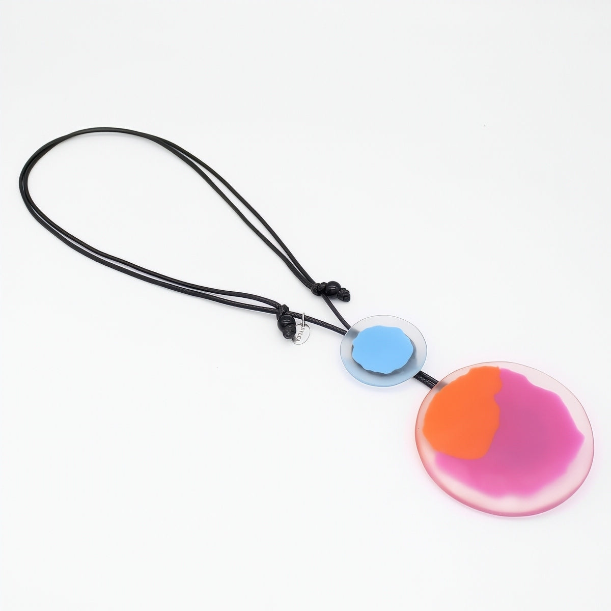 Colorful pendant necklace with a black cord on a white background