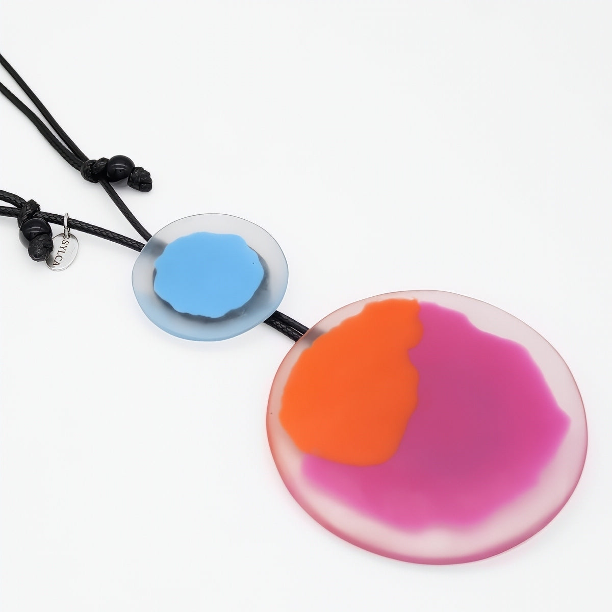 colorful pendant necklaces on a white background