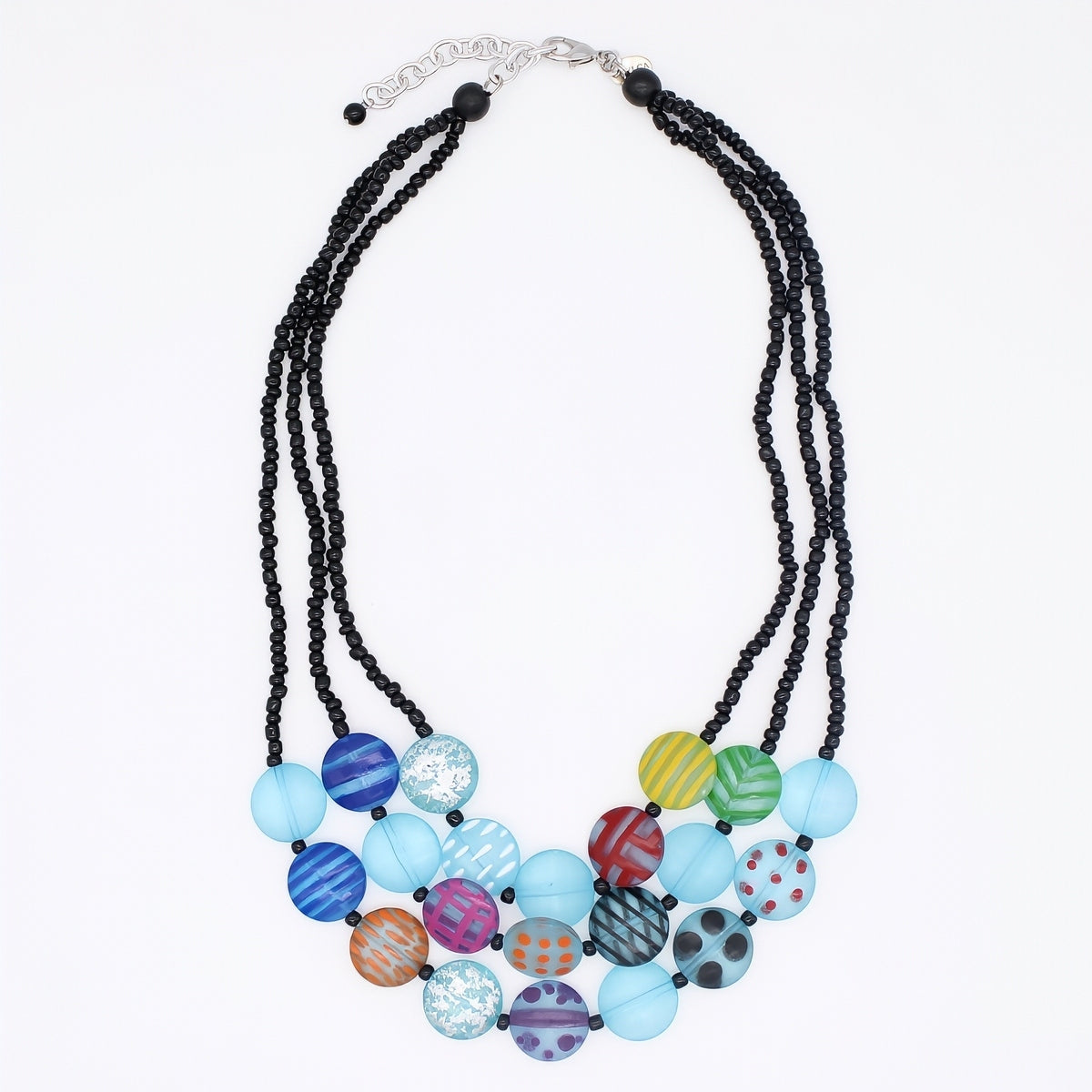 Necklace with black beads and colorful round beads on a white background