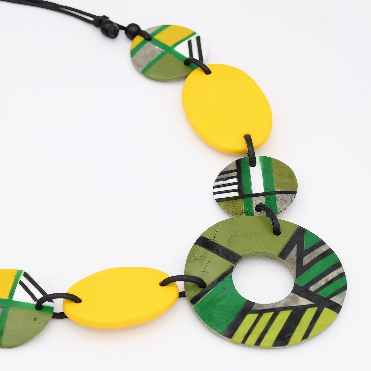 Necklace with colorful circular beads on a white background