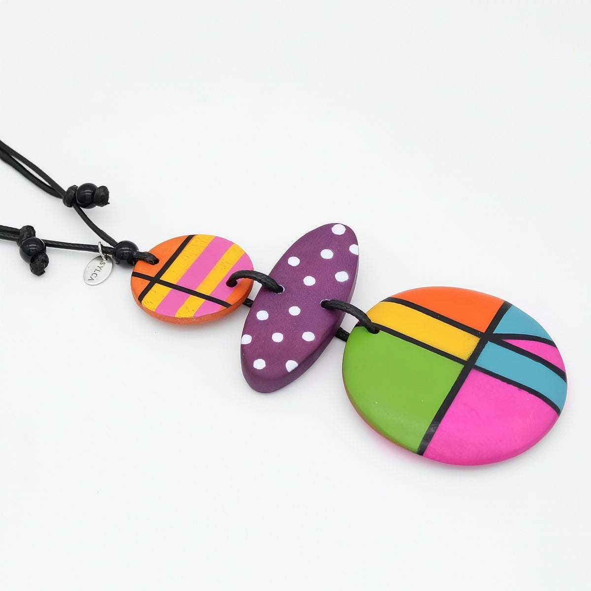 Colorful necklace with round, multicolored pendants on a white background
