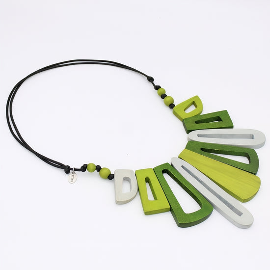 Necklace with green and white geometric pendants on a white background