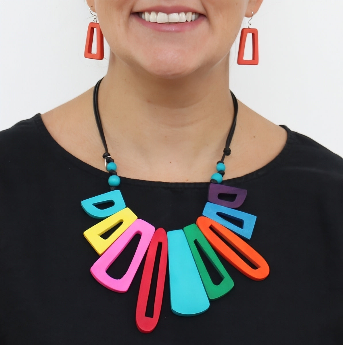 Multi Hues Boho Bloom Necklace, wood beads shaped into floral blooms in a bright multicolor mix on black wax cord