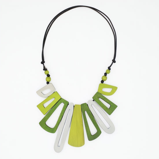 Necklace with green and white geometric pendants on a white background