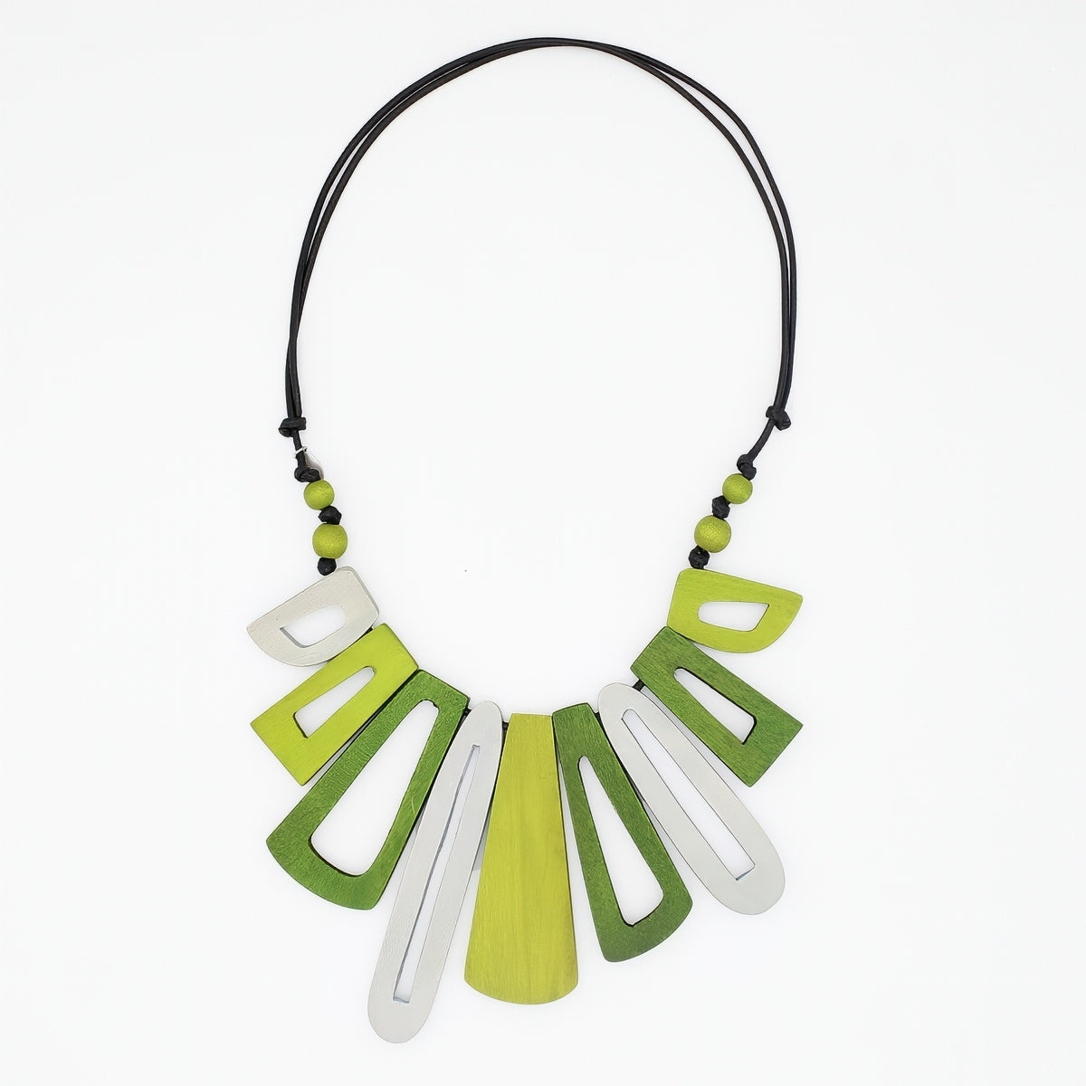 Necklace with green and white geometric pendants on a white background