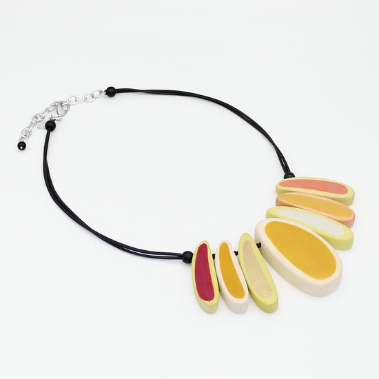 Necklace with colorful oval pendants on a white background