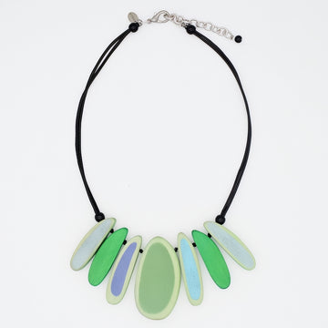 Necklace with green and blue pendant on a white background