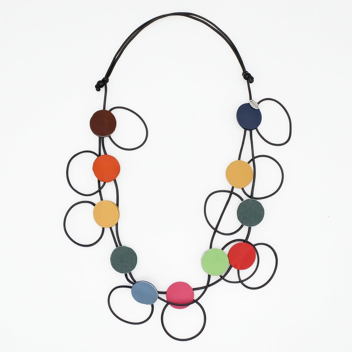 A modern multi-strand statement necklace featuring black elastic cords and multiple colorful circular discs in brown, orange, yellow, green, blue, pink, and red, displayed on a clean white background.