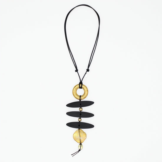 Black and gold sculptural statement necklace on adjustable black cord