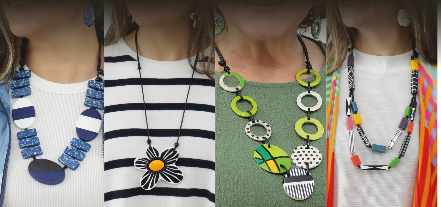 Woman wearing bold geometric statement earrings and necklaces by Sylca Design