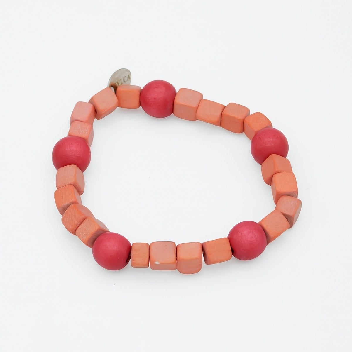 Bracelet with pink and orange beads on a white background