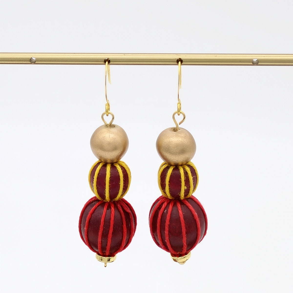 Gold and Maroon Art Deco Earrings by Sylca Designs on a white background
