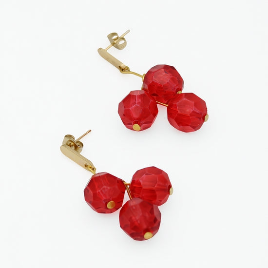Red faceted bead cluster earrings angled product view