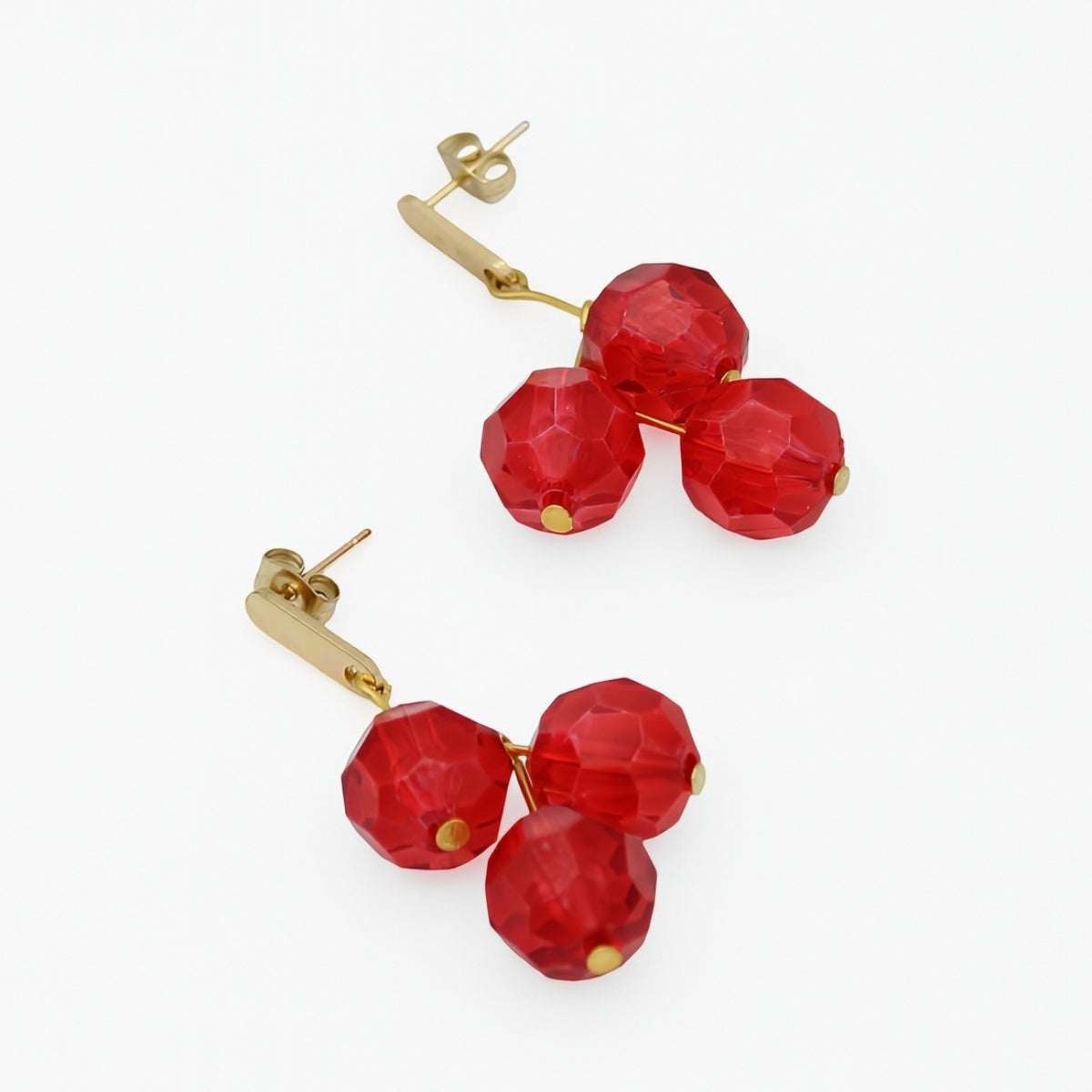 Red faceted bead cluster earrings angled product view