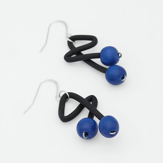 Blue and black artistic drop earrings angled product view