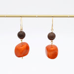 Orange resin and brown wood earrings hanging display