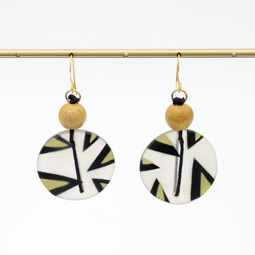 Yellow patterned resin disc earrings hanging display
