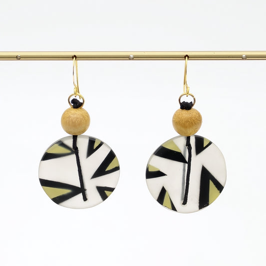 Yellow patterned resin disc earrings hanging display
