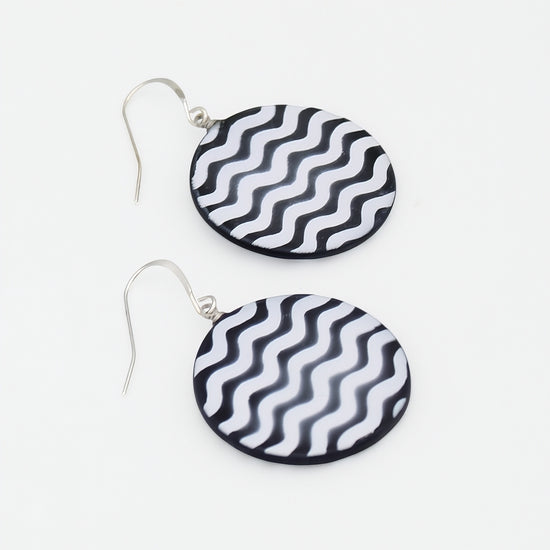 Black and white resin statement earrings angled product view