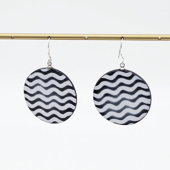 Black and white round resin drop earrings hanging display
