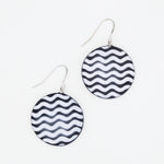 Black and white wavy resin disc earrings with silver plated hooks