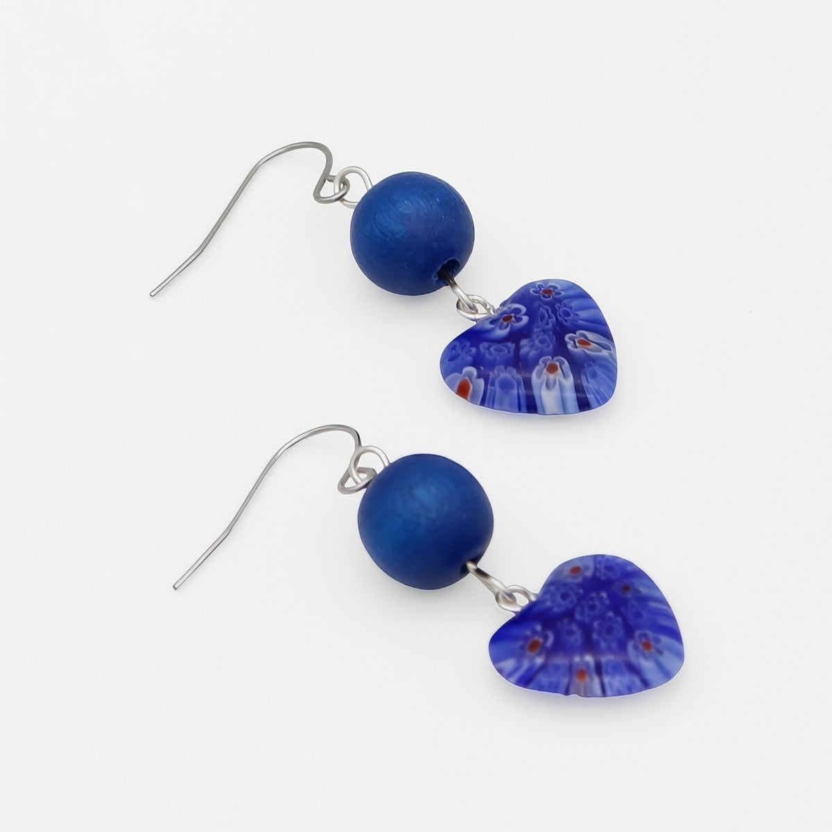 Blue heart resin and wood earrings angled product view