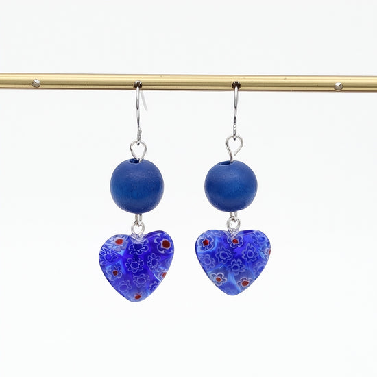 Blue floral heart earrings hanging display