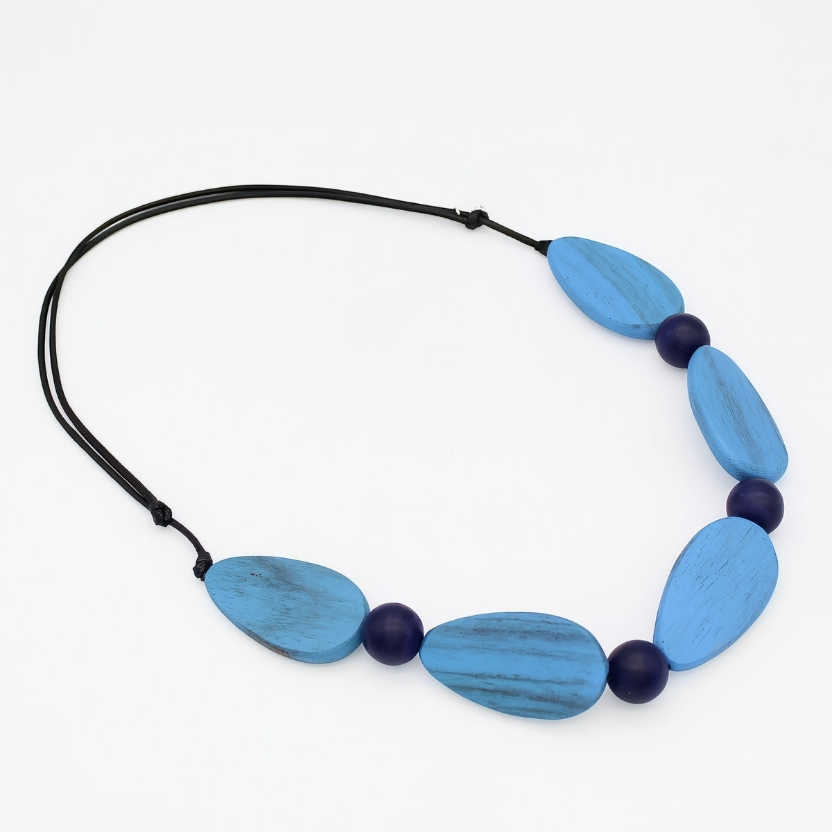 Necklace with blue and black beads on a white background