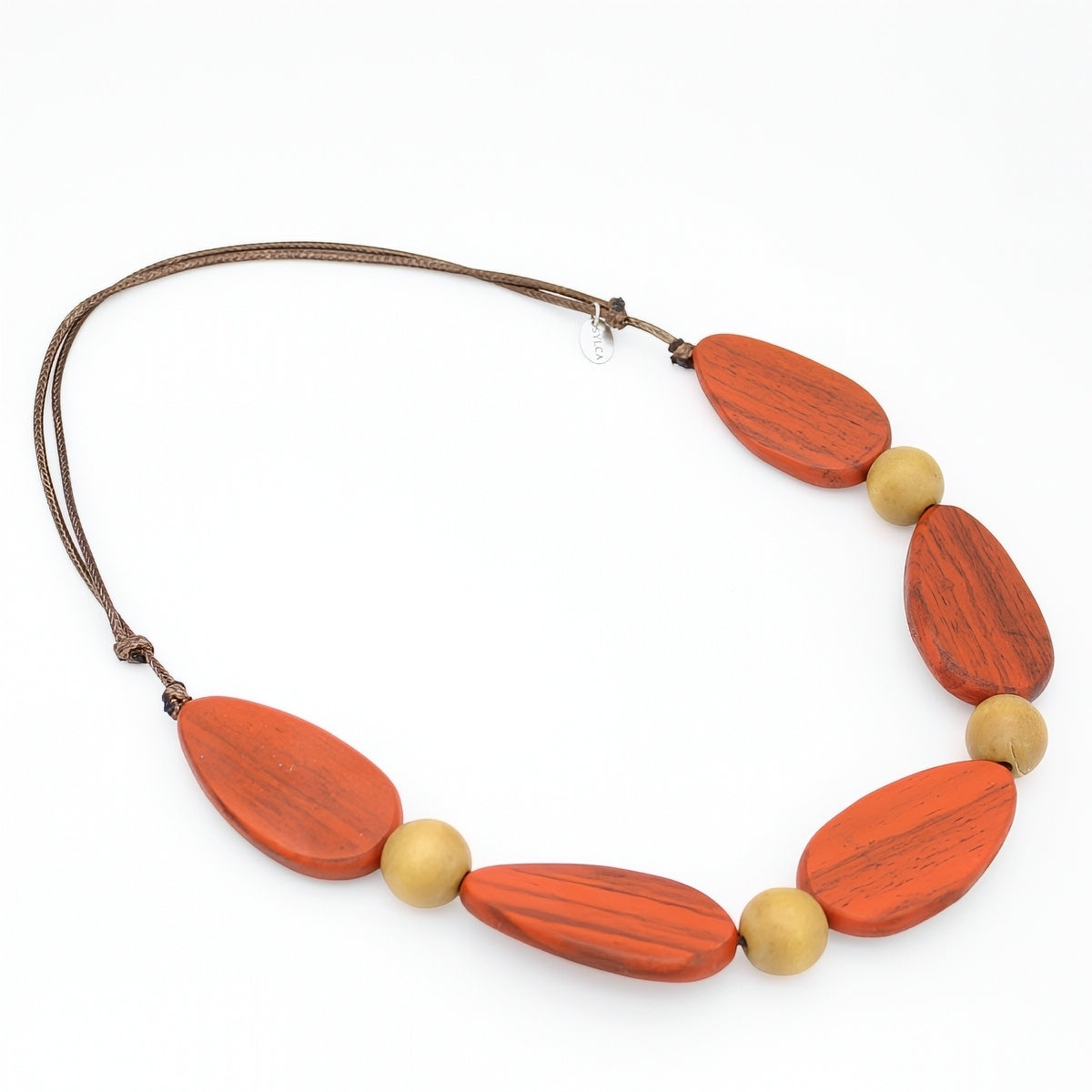 Necklace with orange and beige beads on a white background