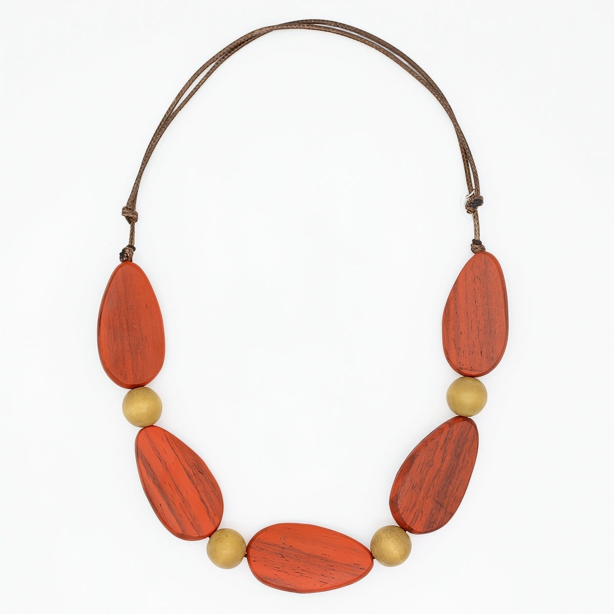 Necklace with orange and gold beads on a white background